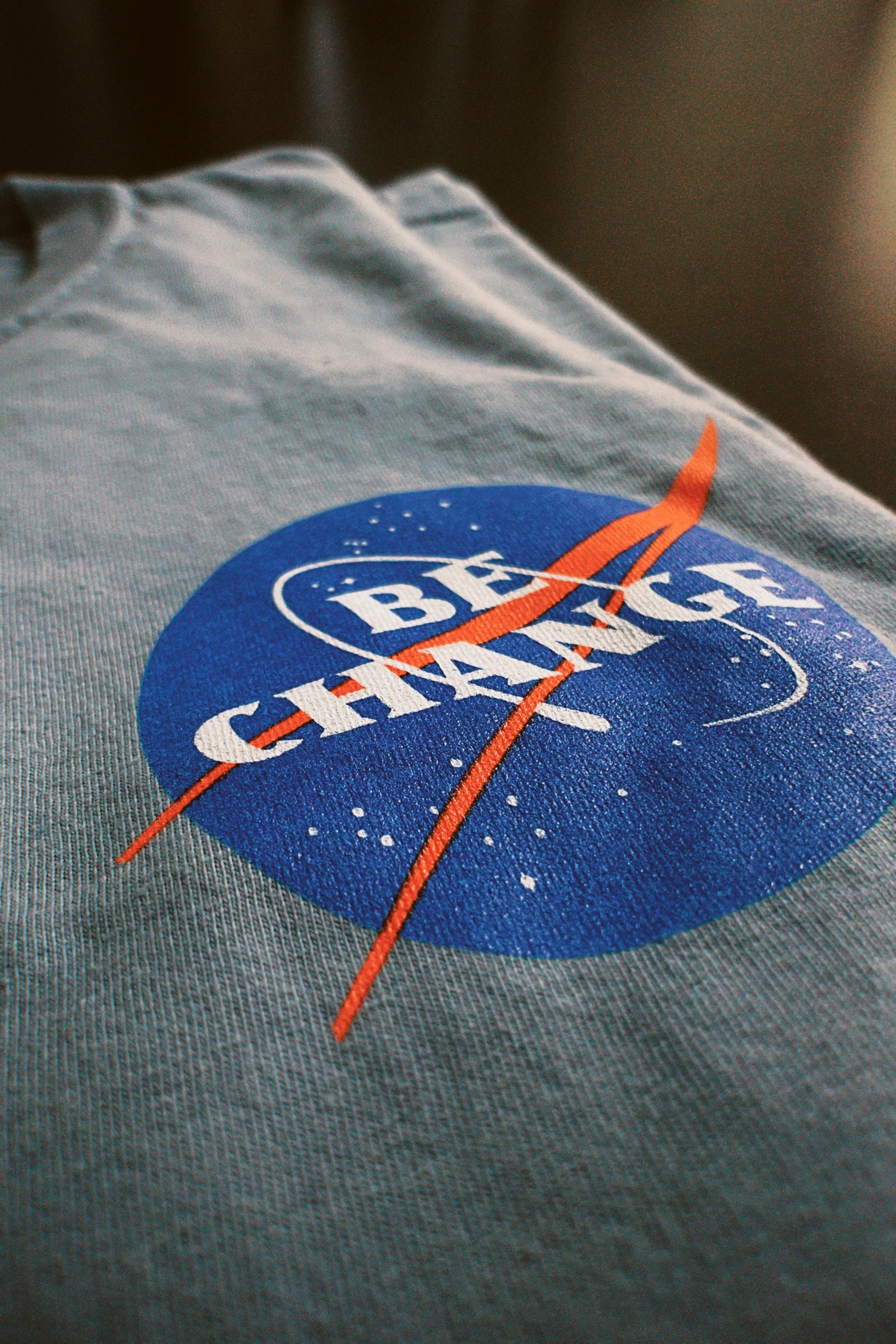 Be Change Aeronautics & Space Tee Grey Front Be Change Logo
